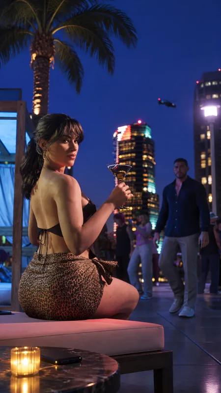 Woman Enjoying a Cocktail at a Vibrant Nightclub