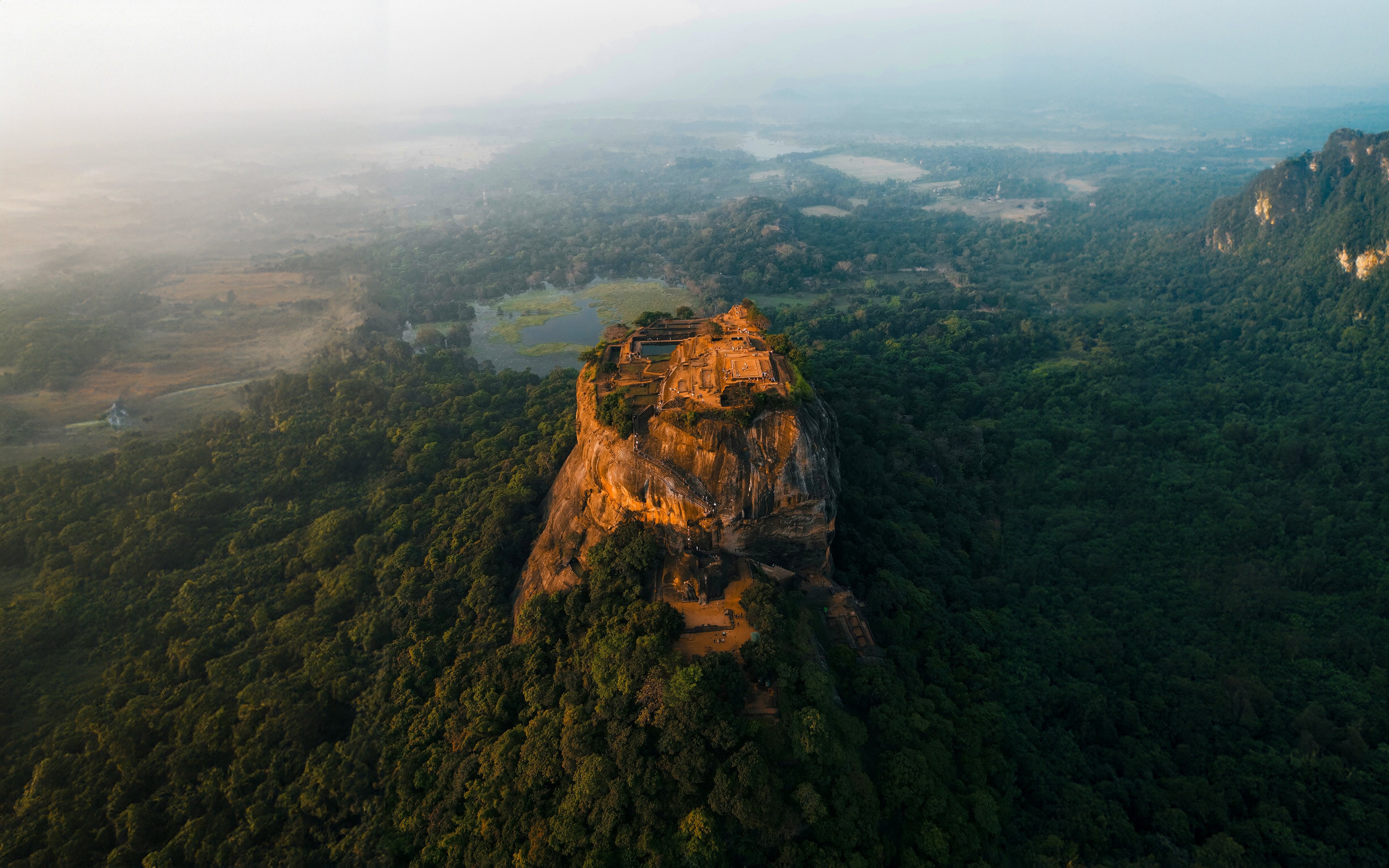 Cinematic Bird's Eye View of Lion Rock Citadel – High Resolution Laptop Wallpaper